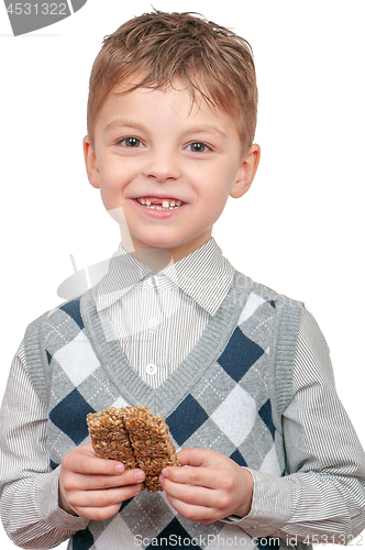 Image of Little boy eating Kozinaki