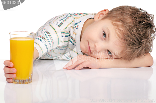 Image of Little boy with orange juice
