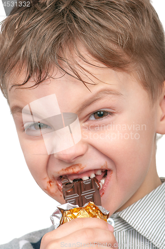 Image of Little boy eating chocolate