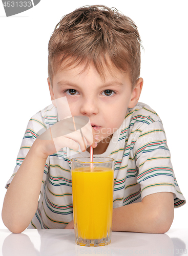 Image of Little boy with orange juice