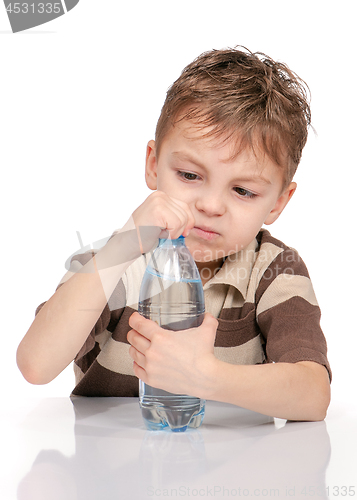 Image of Little boy with bottle of water