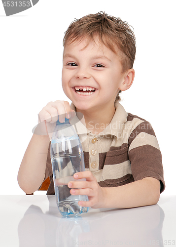 Image of Little boy with bottle of water