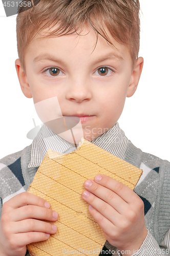 Image of Little boy eating waffle