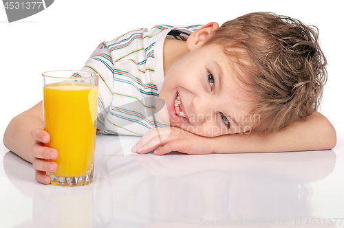 Image of Little boy with orange juice