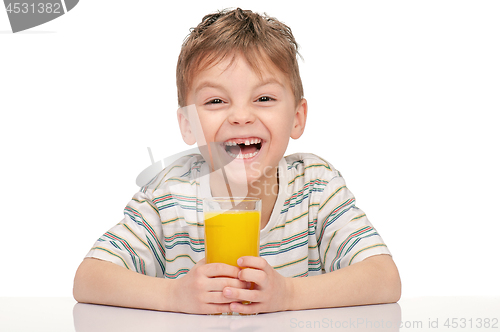 Image of Little boy with orange juice