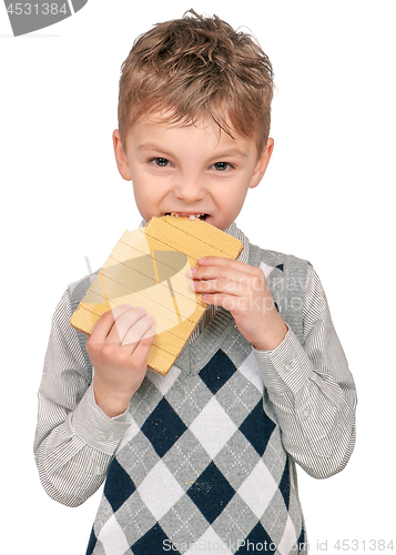 Image of Little boy eating waffle