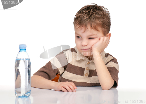 Image of Little boy with bottle of water