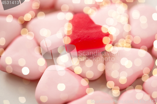 Image of close up of red and pink heart shaped candies