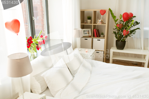 Image of cozy bedroom decorated for valentines day