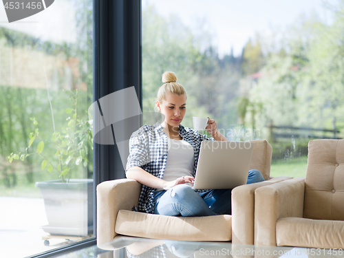 Image of woman drinking coffee enjoying relaxing lifestyle