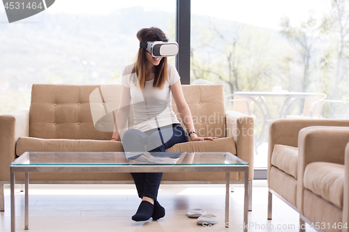 Image of woman using VR-headset glasses of virtual reality