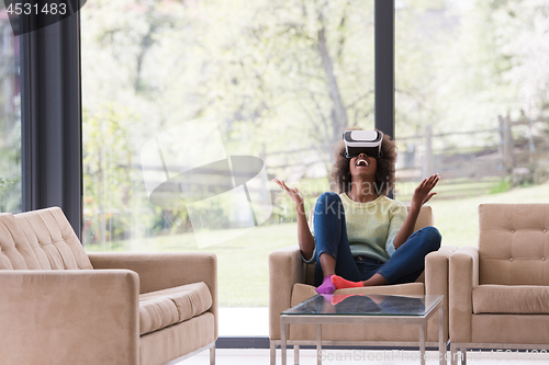 Image of black woman using VR headset glasses of virtual reality