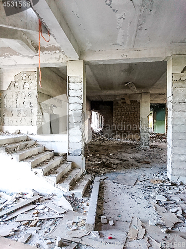 Image of The ruins of a large destroyed building, pieces of stone, concrete, clay and metal.