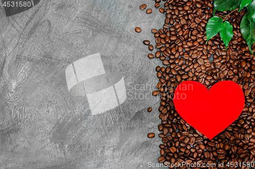 Image of Red cardboard heart on a pile of coffee beans on a vintage background