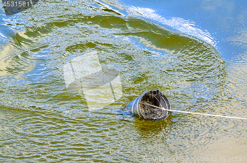 Image of Take samples of water for laboratory testing. The concept - analysis of water purity, environment, ecology.