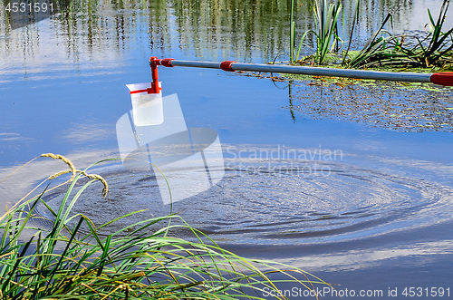 Image of Take samples of water for laboratory testing. The concept - analysis of water purity, environment, ecology.