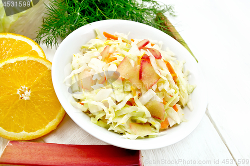 Image of Salad of cabbage and rhubarb in plate on light board