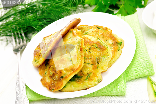 Image of Pancakes of zucchini on board