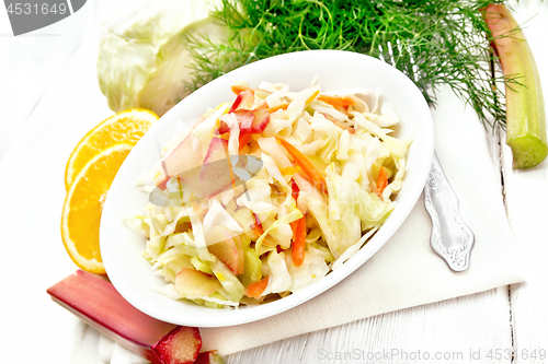 Image of Salad of cabbage and rhubarb in plate on white board