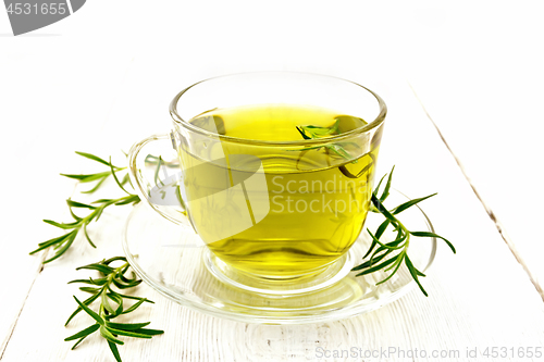 Image of Tea of rosemary in cup on board
