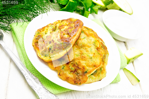 Image of Pancakes of zucchini on white board