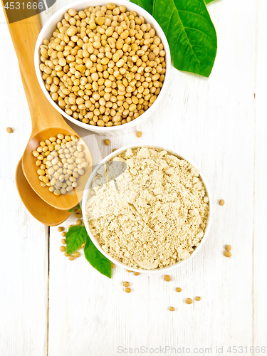 Image of Flour soy with soybeans and leaf on wooden board top
