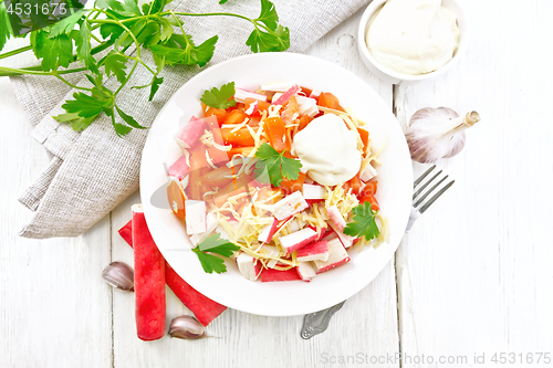 Image of Salad of surimi and tomatoes on board top