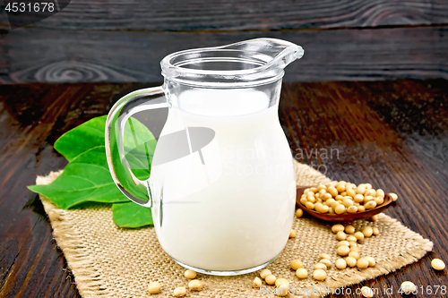 Image of Milk soy in jug with beans on board