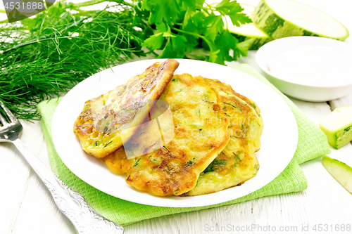 Image of Pancakes of zucchini on napkin