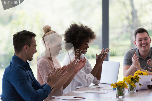 Image of multiethnic startup Group of young business people celebrating s