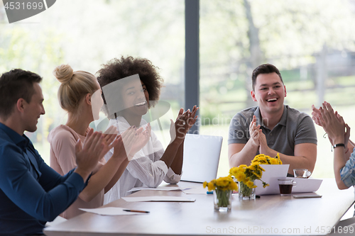 Image of multiethnic startup Group of young business people celebrating s