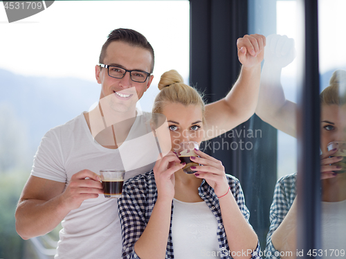 Image of young couple enjoying morning coffee