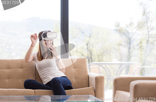 Image of woman using VR-headset glasses of virtual reality