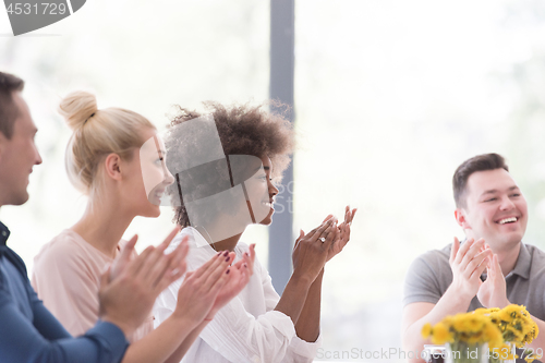 Image of multiethnic startup Group of young business people celebrating s