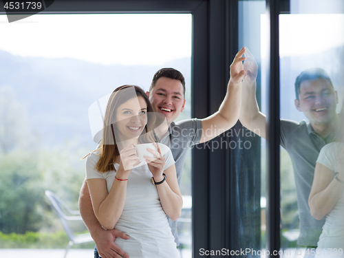Image of young couple enjoying morning coffee