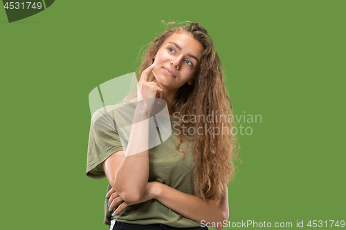 Image of Young serious thoughtful woman. Doubt concept.