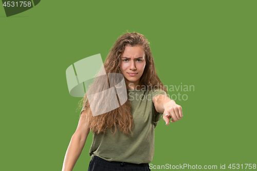 Image of The overbearing business woman point you and want you, half length closeup portrait on green background.