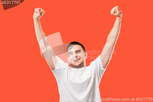 Image of Winning success man happy ecstatic celebrating being a winner. Dynamic energetic image of male model