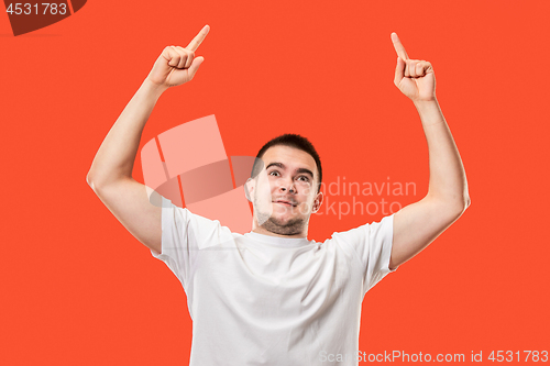 Image of Winning success man happy ecstatic celebrating being a winner. Dynamic energetic image of male model