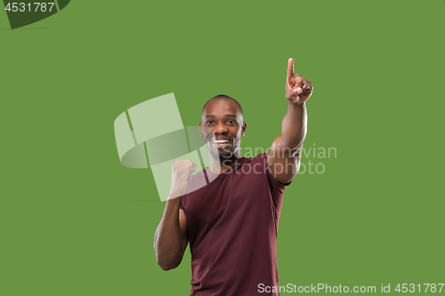 Image of Winning success man happy ecstatic celebrating being a winner. Dynamic energetic image of male model