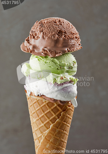 Image of various ice cream balls in waffle cone