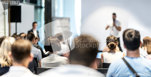 Image of Male business speaker giving a talk at business conference event.