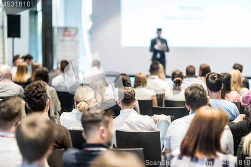 Image of Male business speaker giving a talk at business conference event.