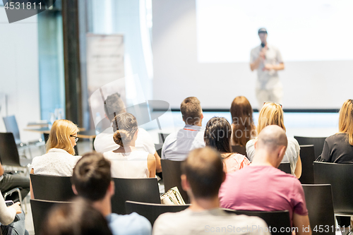 Image of Male business speaker giving a talk at business conference event.