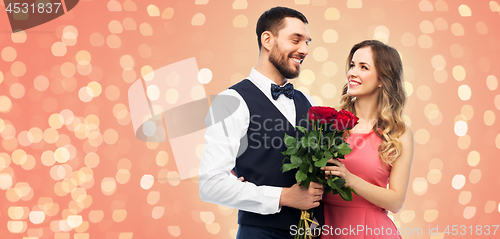 Image of couple with bunch of flowers on valentines day