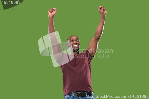 Image of Winning success man happy ecstatic celebrating being a winner. Dynamic energetic image of male model