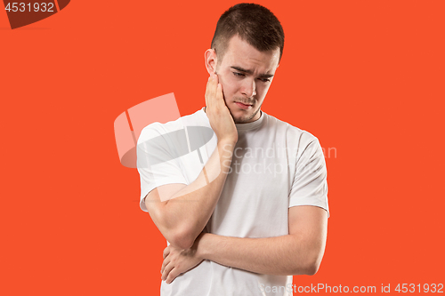 Image of Young man is having toothache.