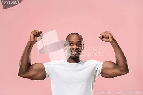 Image of Winning success man happy ecstatic celebrating being a winner. Dynamic energetic image of male model