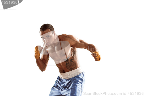 Image of Sporty man during boxing exercise. Photo of boxer on white background