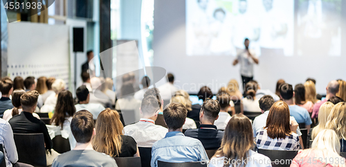 Image of Male business speaker giving a talk at business conference event.